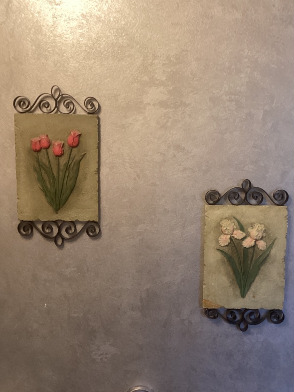 Metal and ceramic floral wall hangings